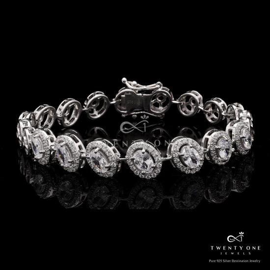 Premium 50 Pointer Oval Solitaire Tennis Bracelet with Diamond Cluster on Pure 925 Silver.