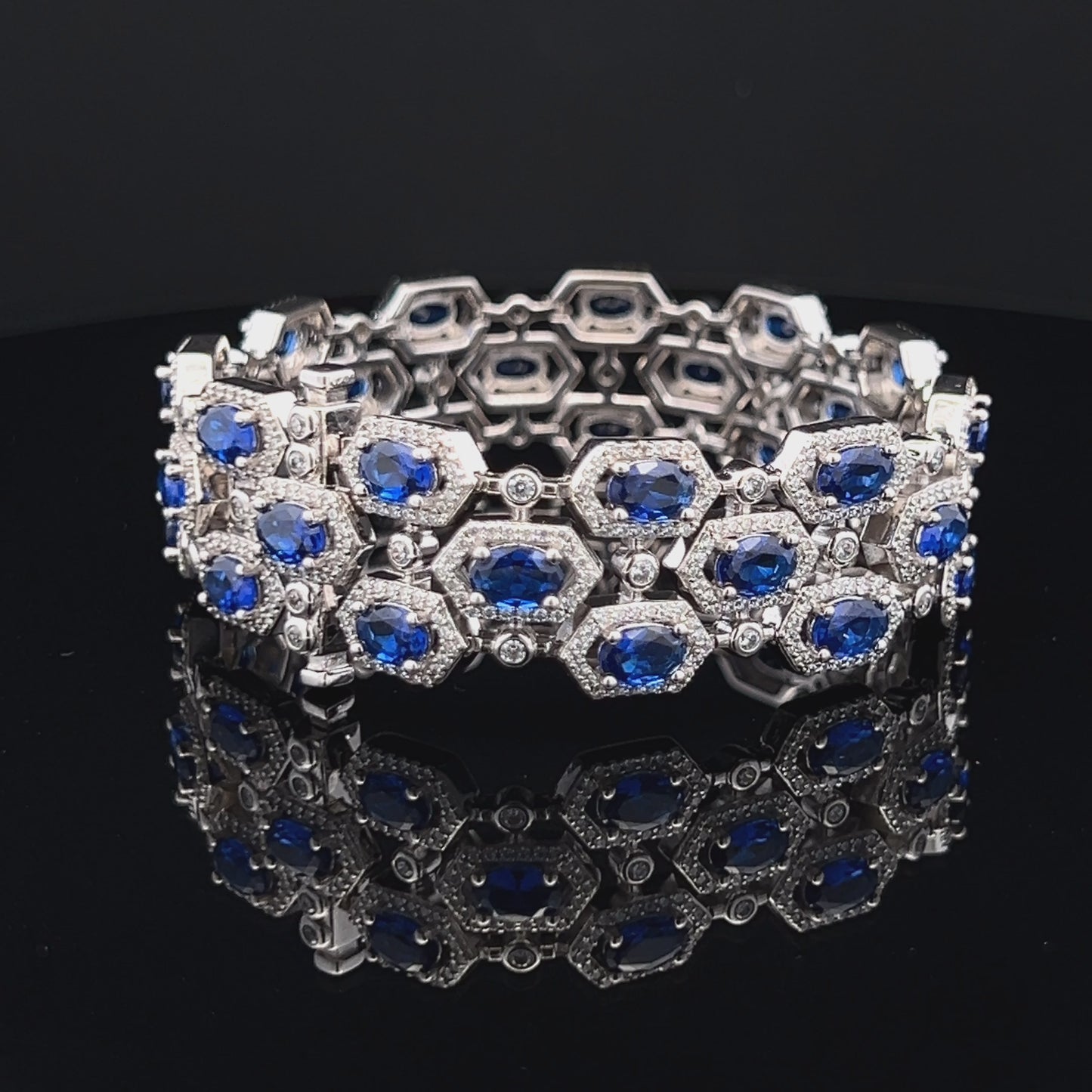 Load and play video in Gallery viewer, Oval Tanzanite Hexa Setting Ultra Premium Broad Statement Pure 925 Silver Bracelet
