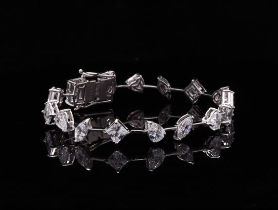 Load and play video in Gallery viewer, Premium Multi Solitaire American Diamond Tennis Bracelet on Pure 925 Silver.
