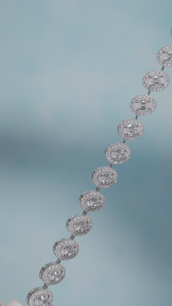 Load and play video in Gallery viewer, Premium 50 Pointer Oval Solitaire Tennis Bracelet with Diamond Cluster on Pure 925 Silver.
