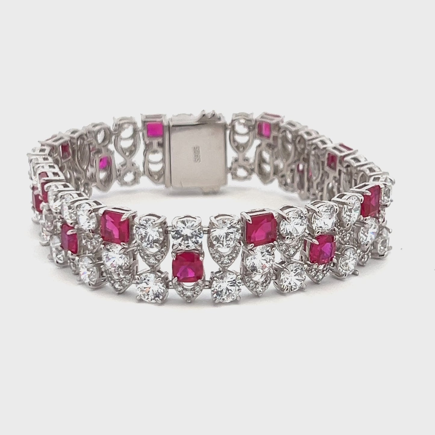 Load and play video in Gallery viewer, Ultra Premium Chunky Princess Cut Ruby Tennis Bracelet with 50 Pointer Round Cut Solitaires on Pure 925 Silver
