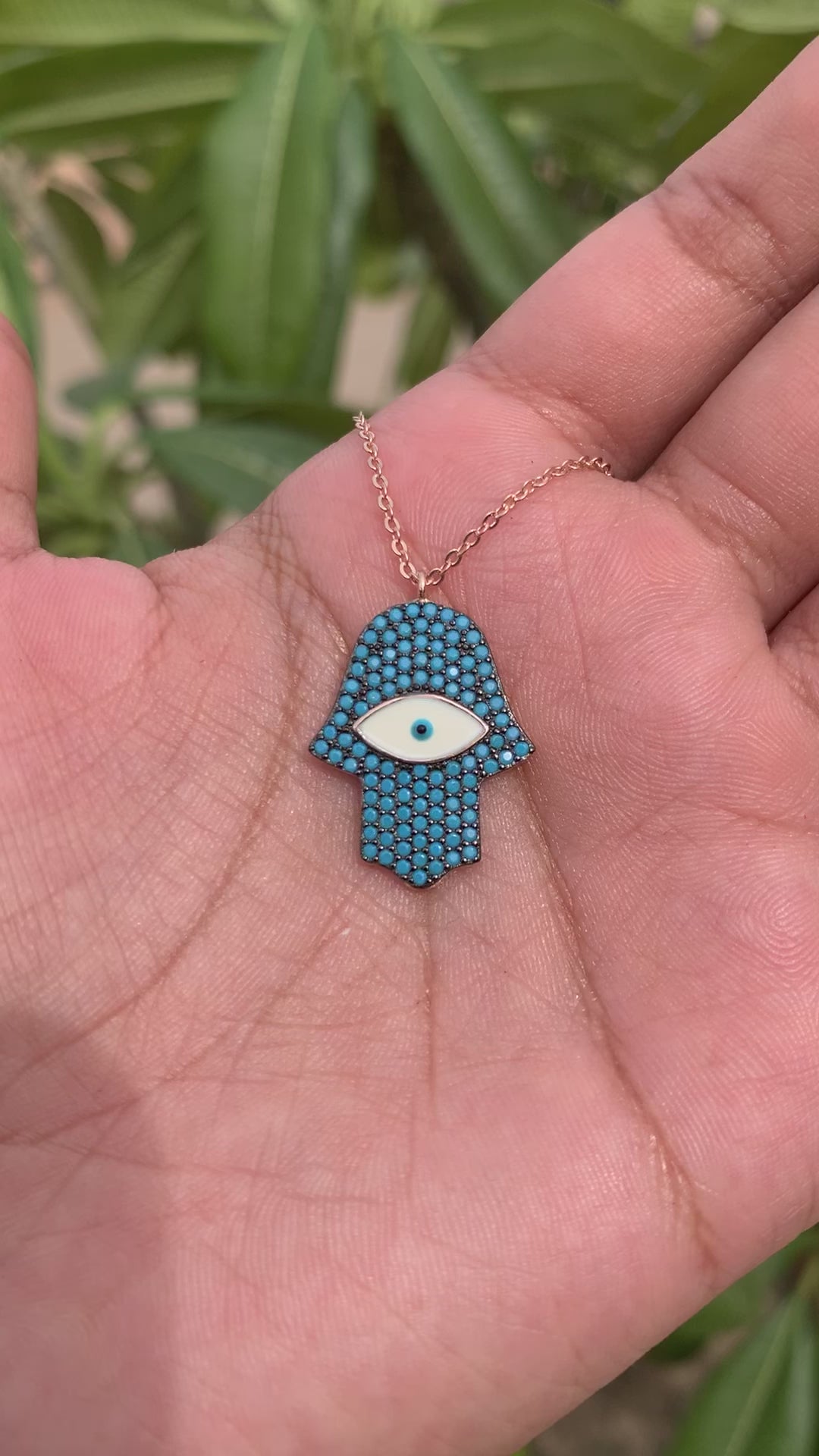 Load and play video in Gallery viewer, Blue Sapphire Hamza Hand with Evil Eye Rose Gold Pendant with chain on Pure 925 Silver
