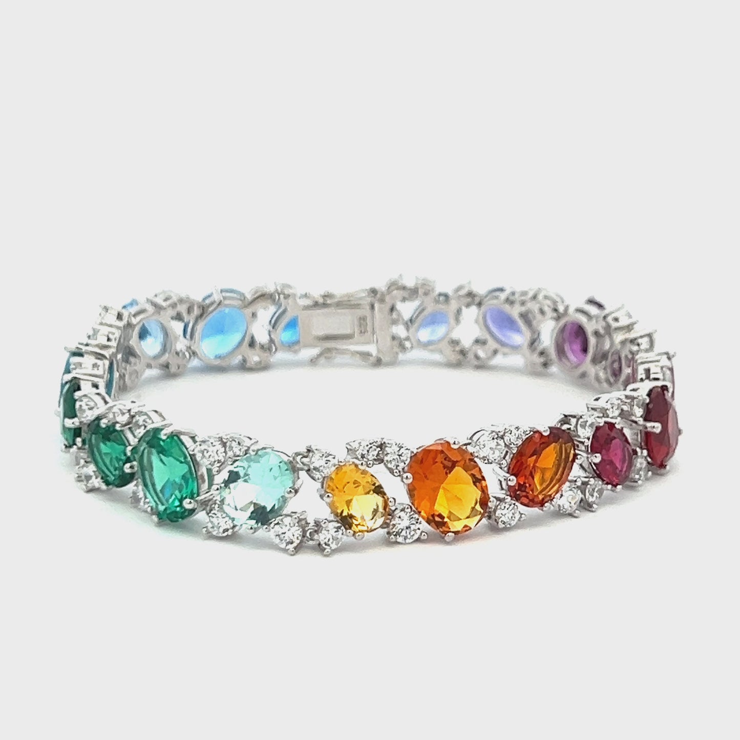 Load and play video in Gallery viewer, Ultra Premium White Gold Finish Oval Cut Solitaire Rainbow Tennis Bracelet on Pure 925 Silver
