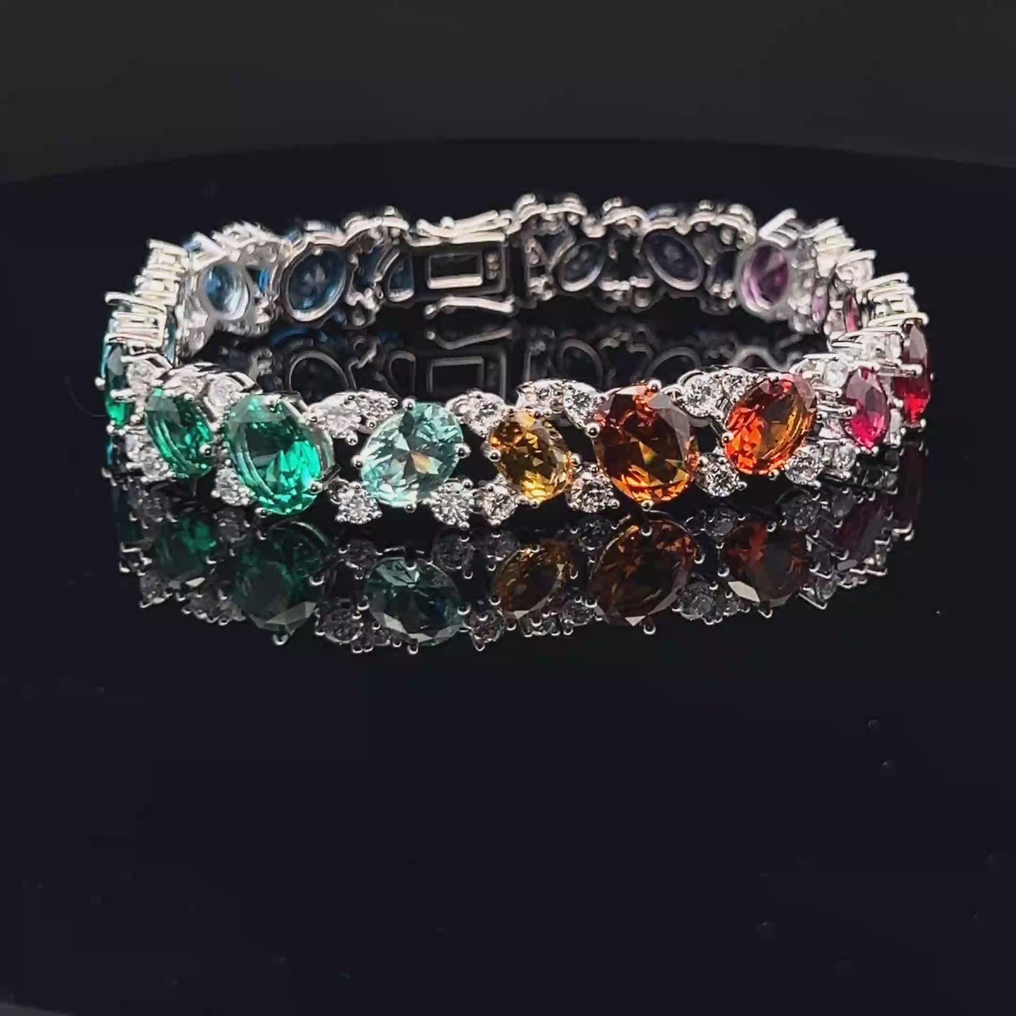 Load and play video in Gallery viewer, Ultra Premium White Gold Finish Oval Cut Solitaire Rainbow Tennis Bracelet on Pure 925 Silver
