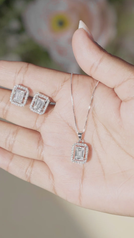 Load and play video in Gallery viewer, Premium 1.5 Carat Emerald Cut Solitaire Princia Pendant Set On 925 Silver with Premium Screw Back Studs

