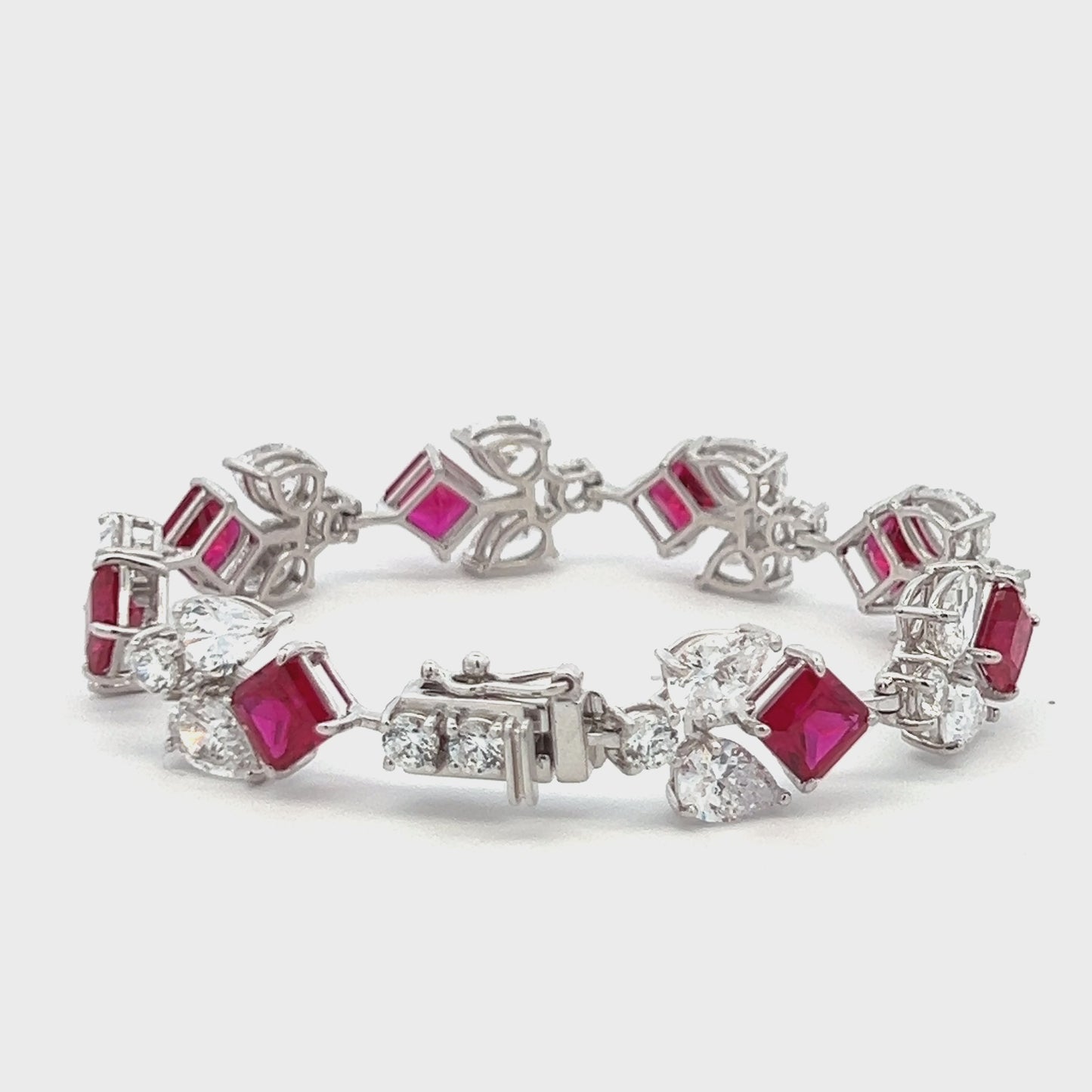 Load and play video in Gallery viewer, Ultra Premium Ruby Ice Cut Multi Solitaire Tennis Bracelet on Pure 925 Silver with Box Lock and Double Side Rhodium Plating
