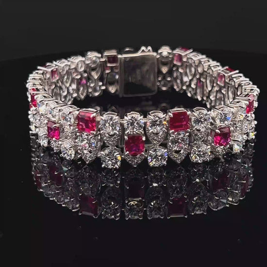 Load and play video in Gallery viewer, Ultra Premium Chunky Princess Cut Ruby Tennis Bracelet with 50 Pointer Round Cut Solitaires on Pure 925 Silver
