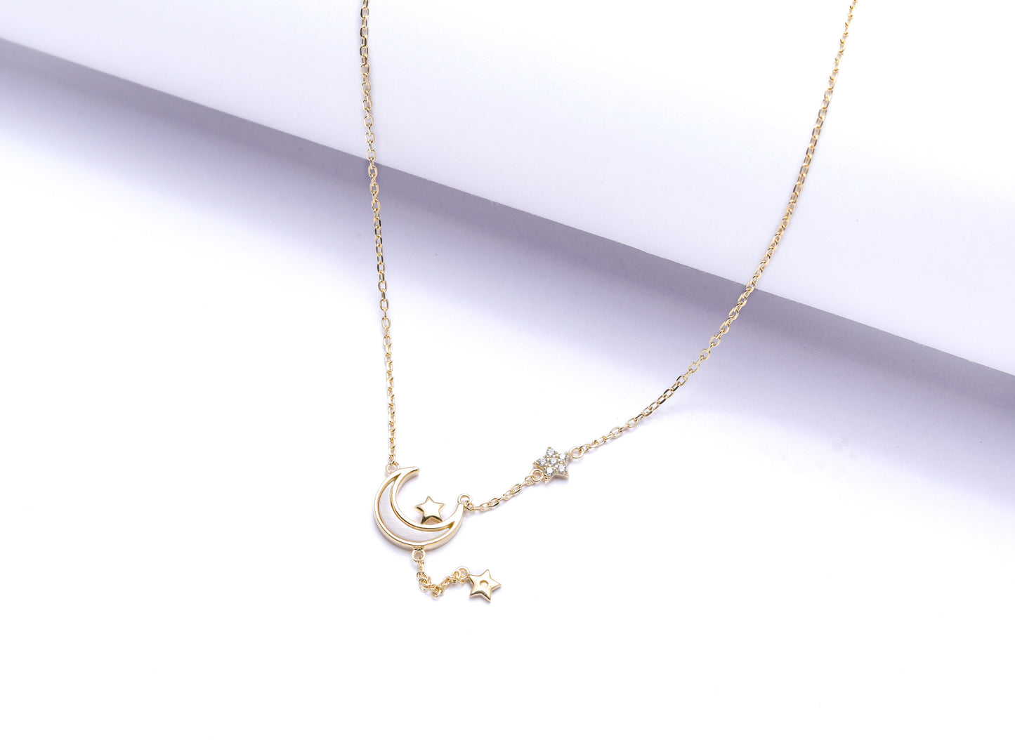 The Trailing Star and Moon Benita Gold Finish Necklace